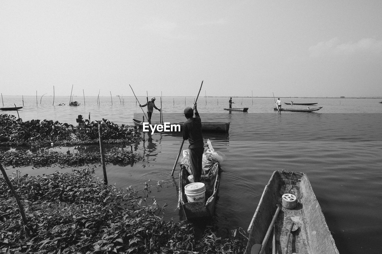 VIEW OF BOATS IN SEA