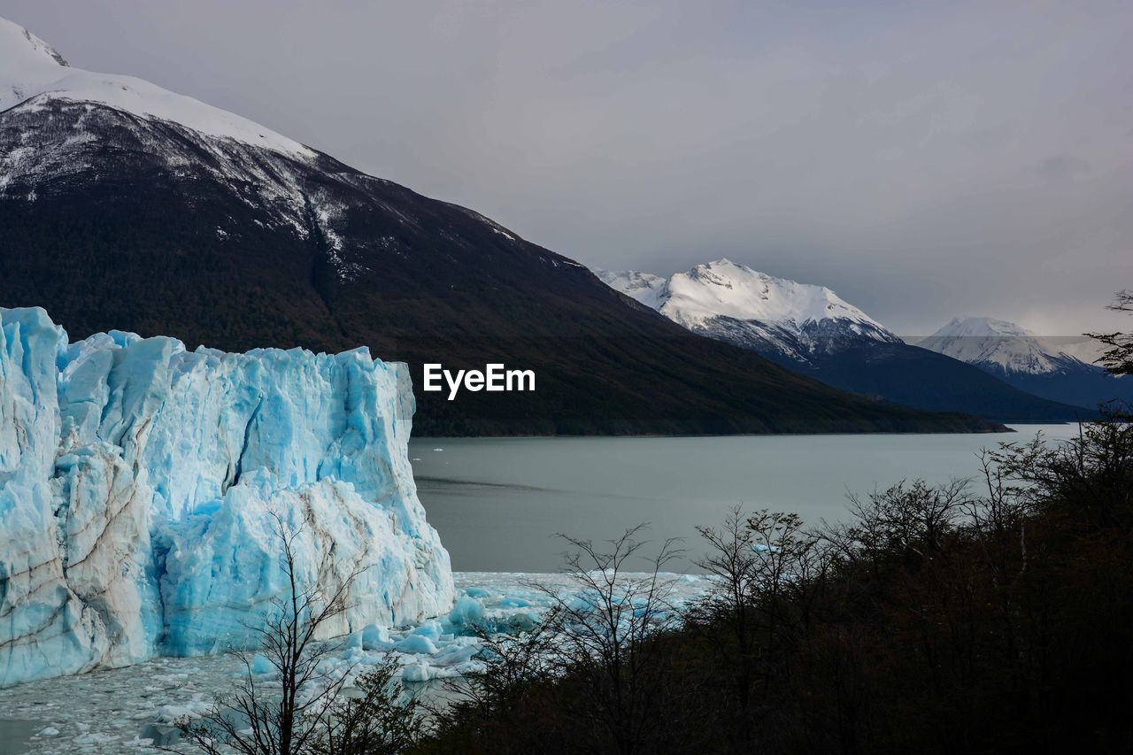 Moreno glacier with snowcapped mountains in background