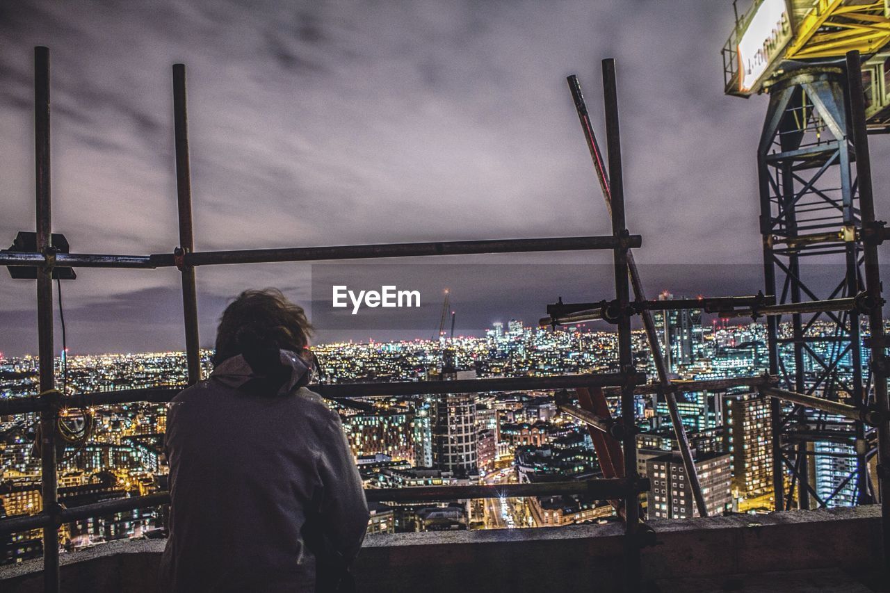 Person looking at illuminated city