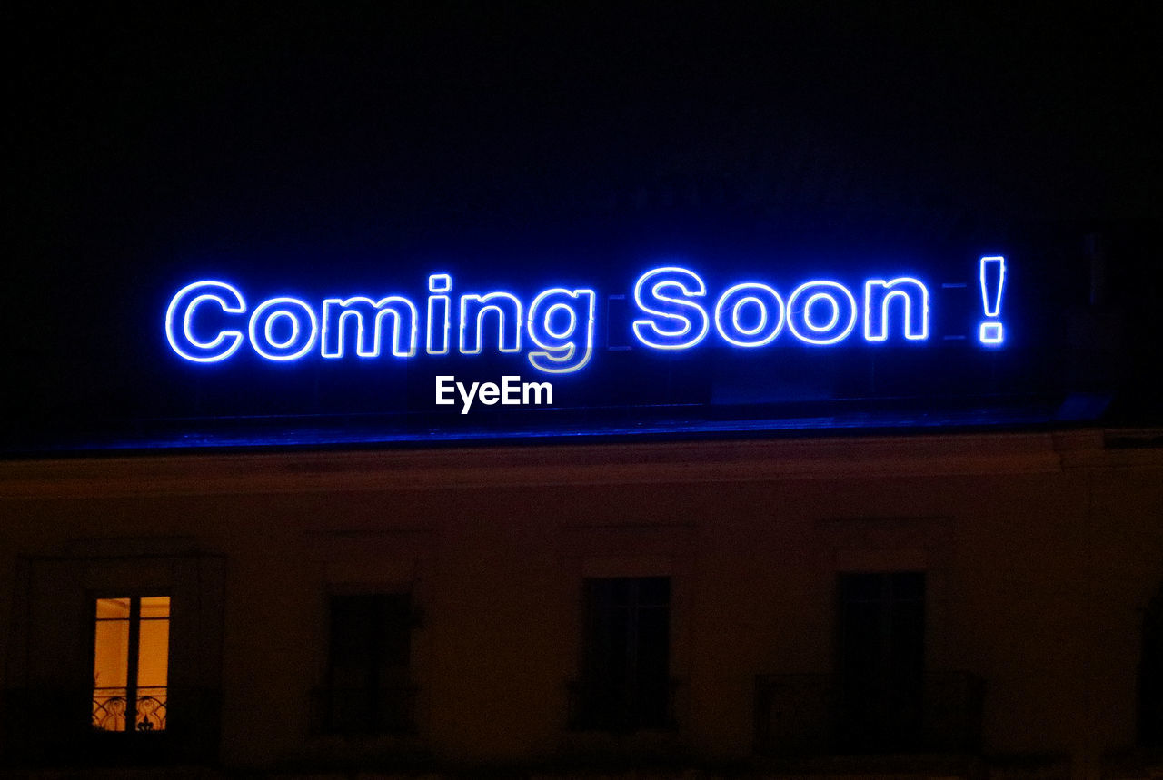 night, illuminated, text, communication, western script, sign, architecture, light, no people, signage, neon sign, built structure, building exterior, neon, darkness, lighting, blue, dark, display device