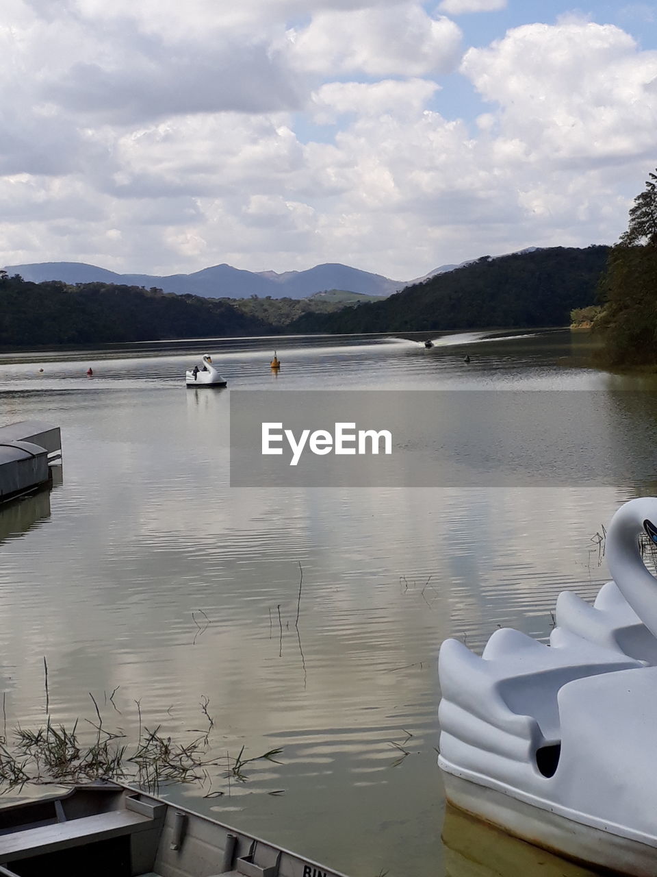 BOATS ON LAKE AGAINST SKY