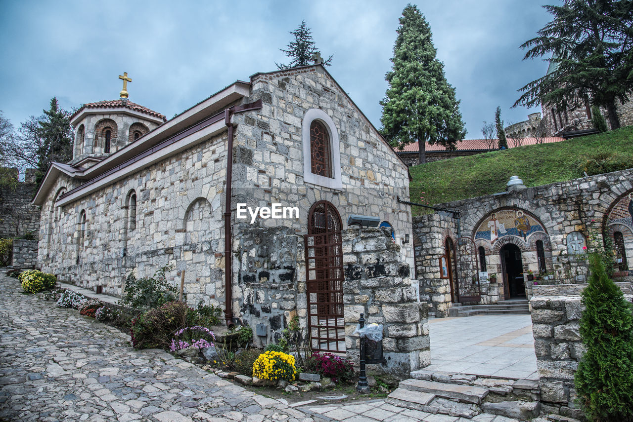 CHURCH AGAINST CLOUDY SKY