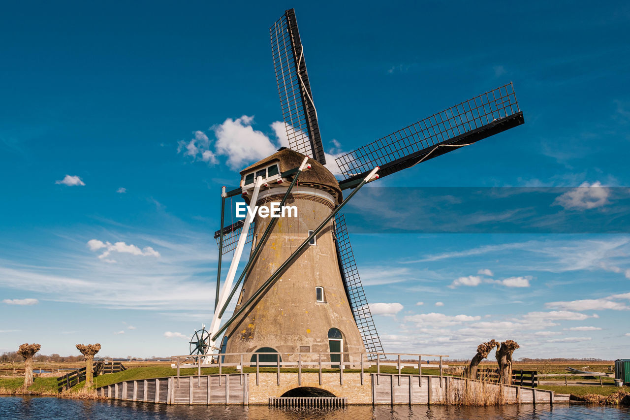 Traditional windmill against blue sky