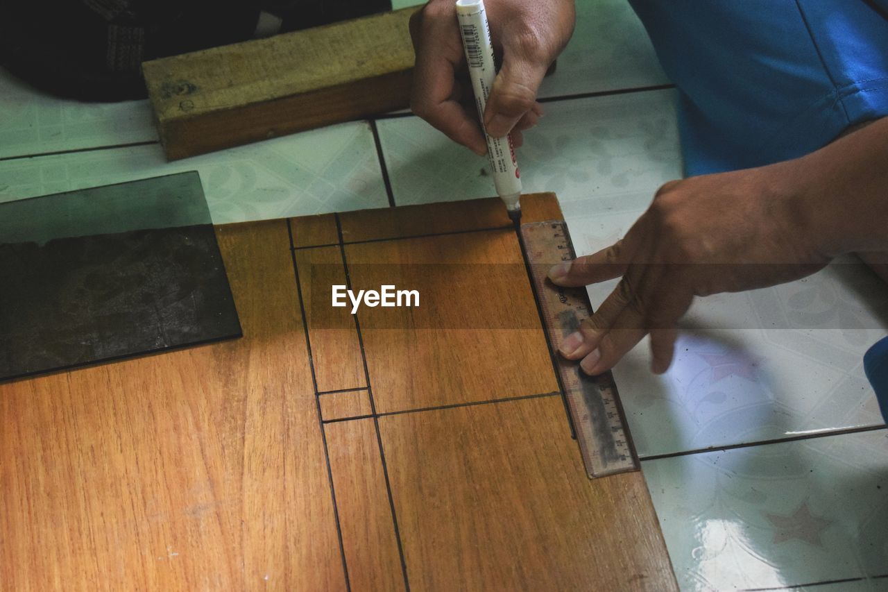 High angle view of man working on table