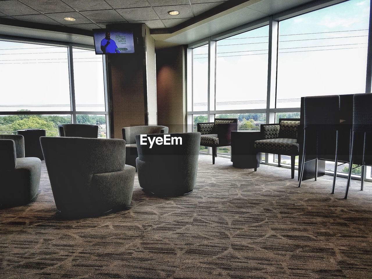 CHAIRS AND TABLES IN WINDOW