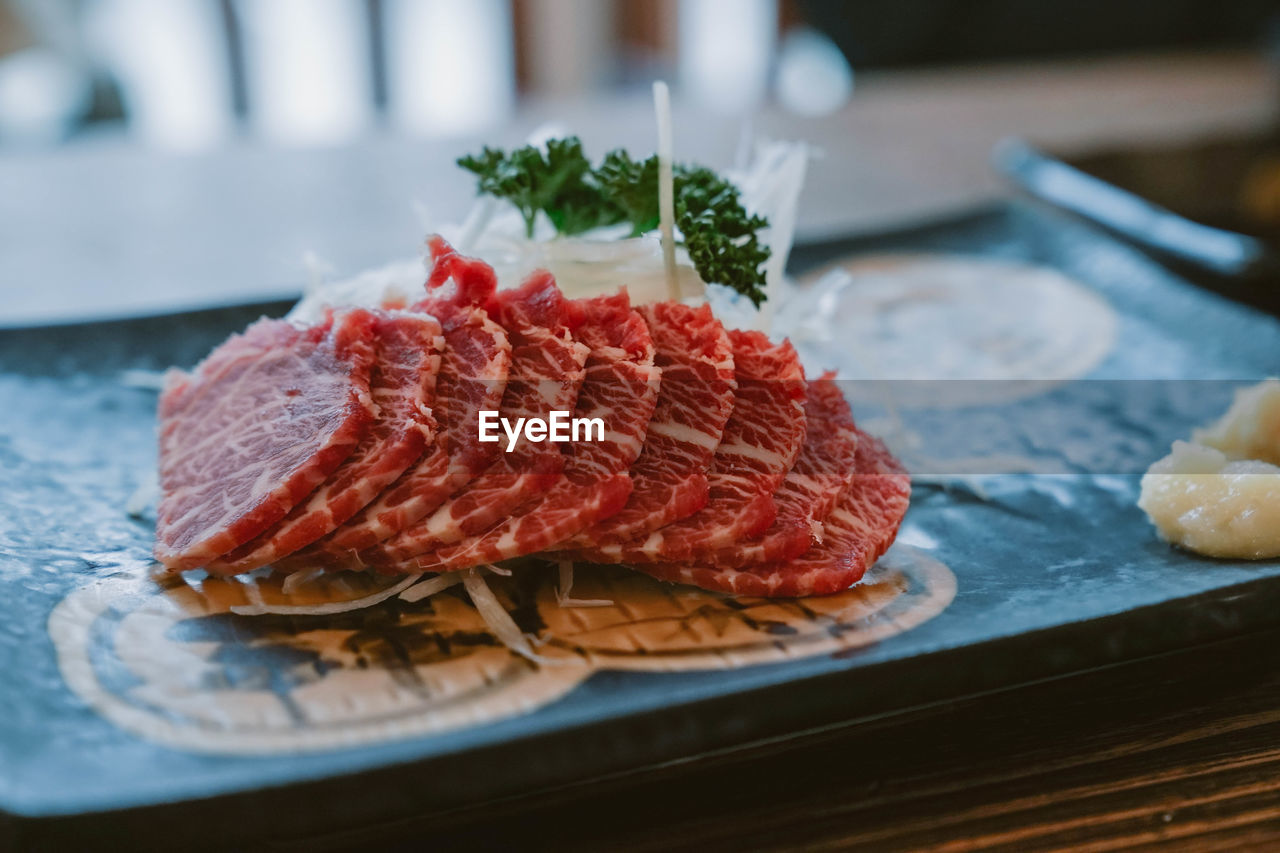 Close-up of meat in plate on table