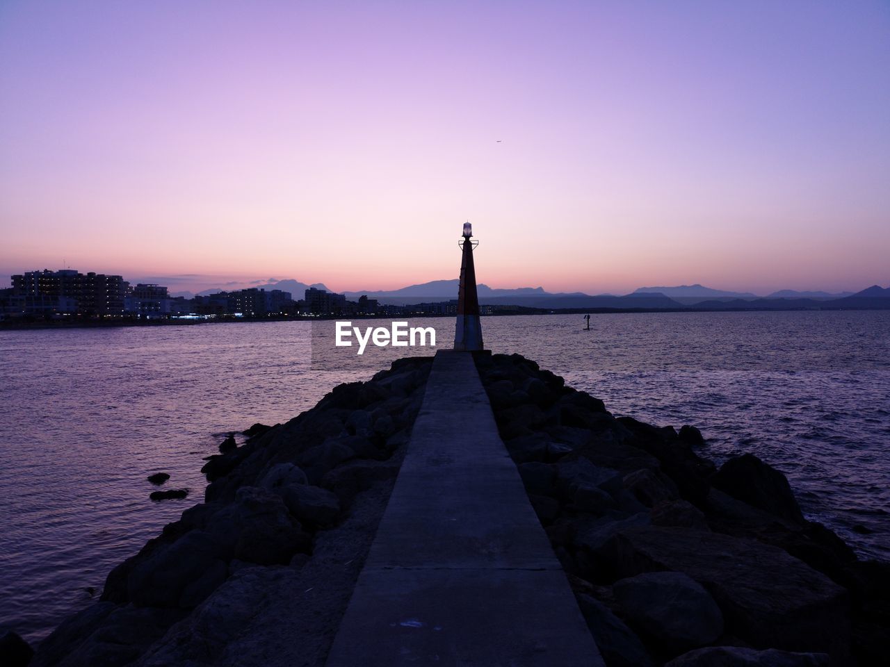 Scenic view of sea against sky at sunset