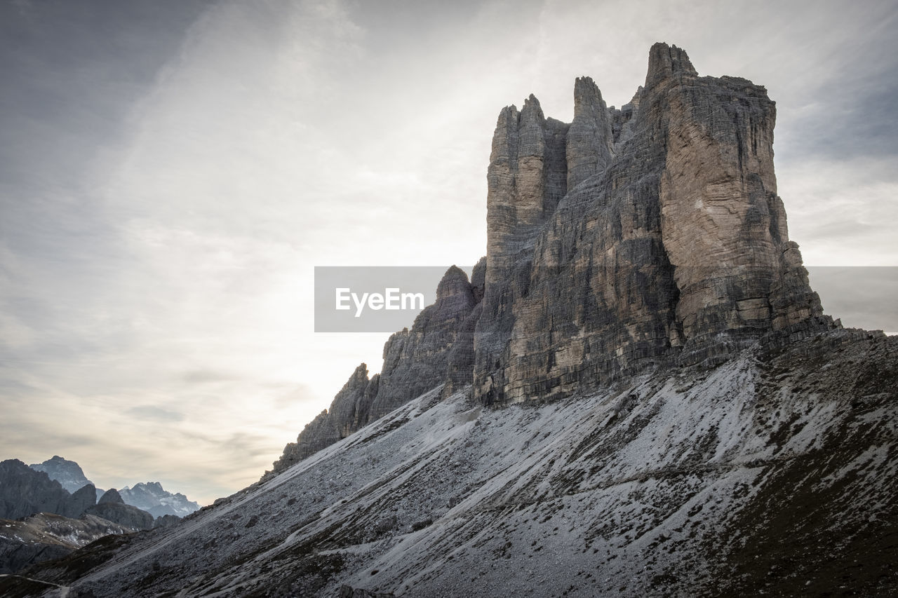 Low angle view of rock formation against sky