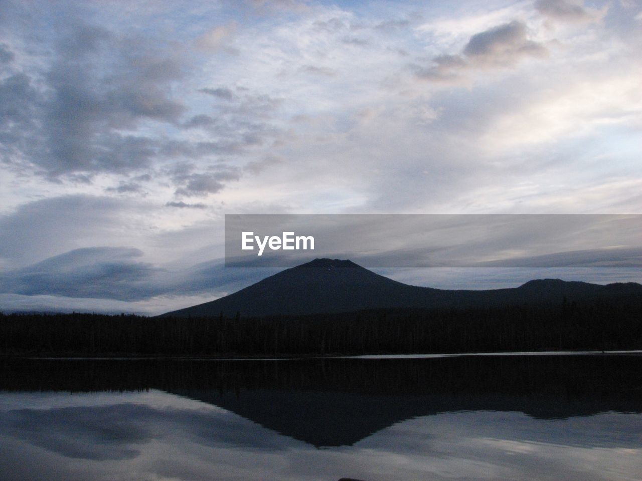 SCENIC VIEW OF MOUNTAINS AGAINST CLOUDY SKY