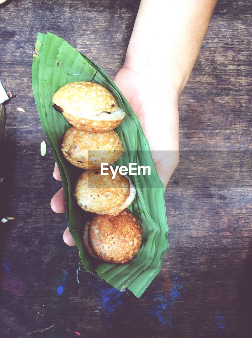 Close-up of hand holding snacks