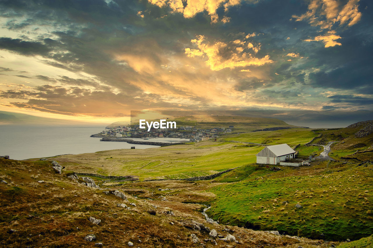 Scenic view of sea against sky during sunset faroe islands 