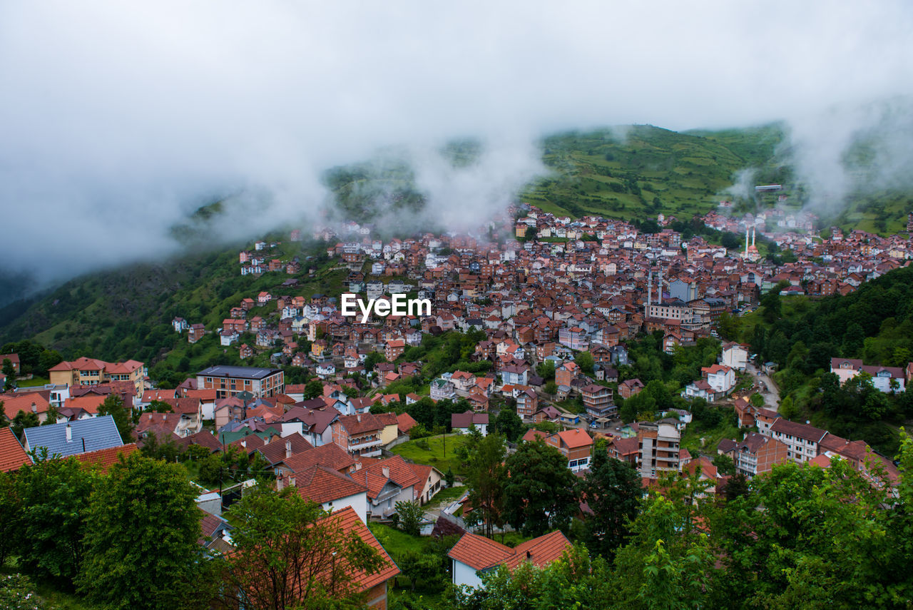 Aerial view of townscape against sky