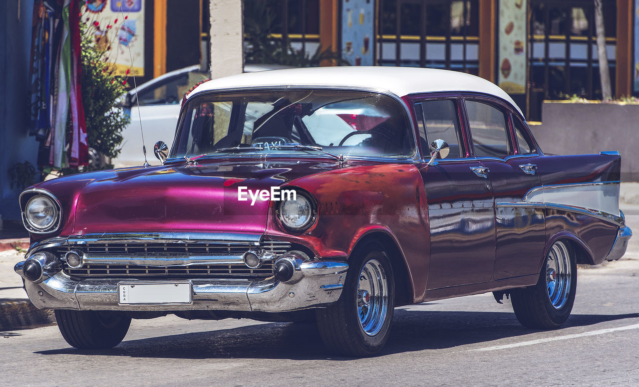 Vintage car on road in city