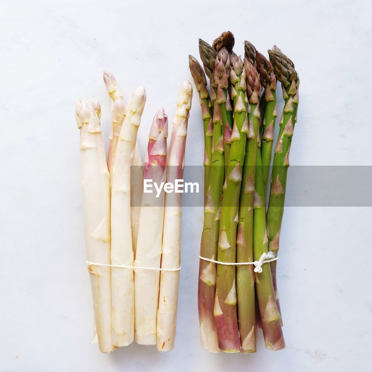 HIGH ANGLE VIEW OF VEGETABLES ON WHITE TABLE