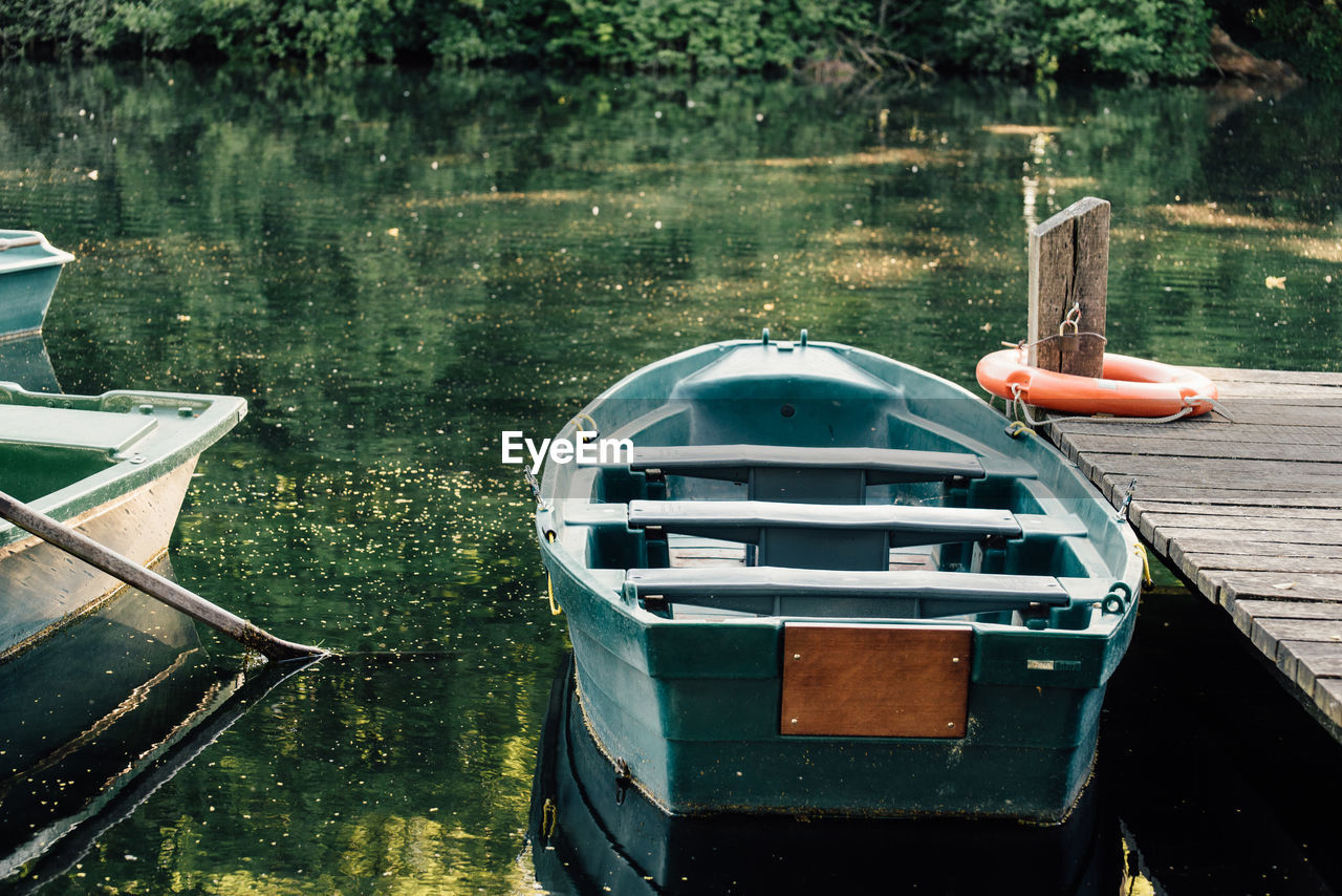 BOAT MOORED IN LAKE