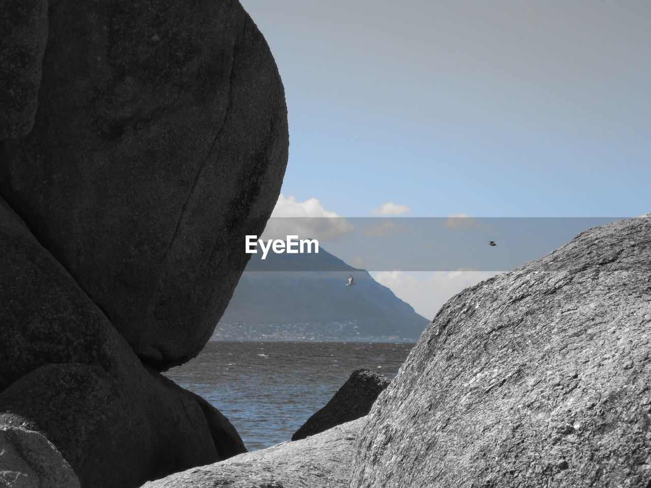 SCENIC VIEW OF SEA BY CLIFF AGAINST SKY