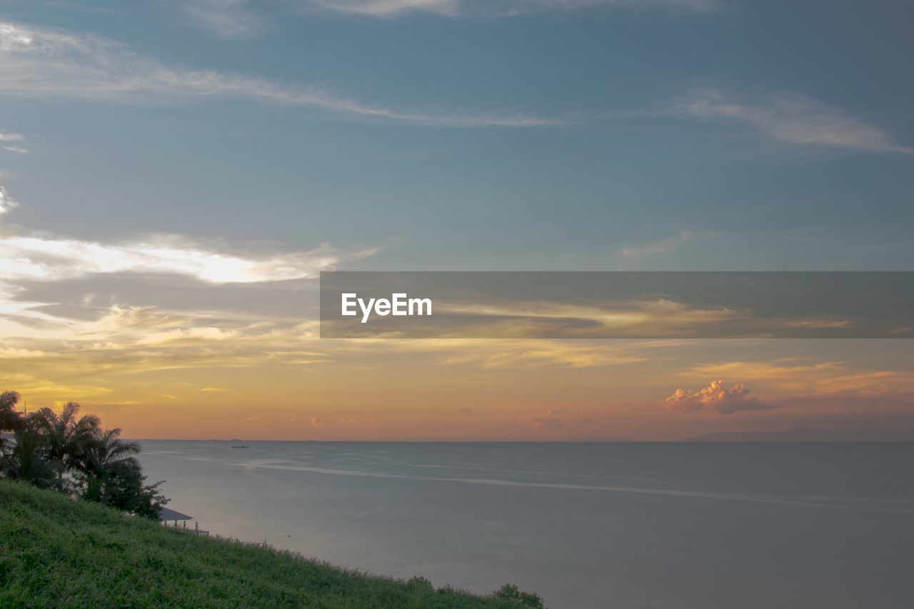 SCENIC VIEW OF SEA DURING SUNSET