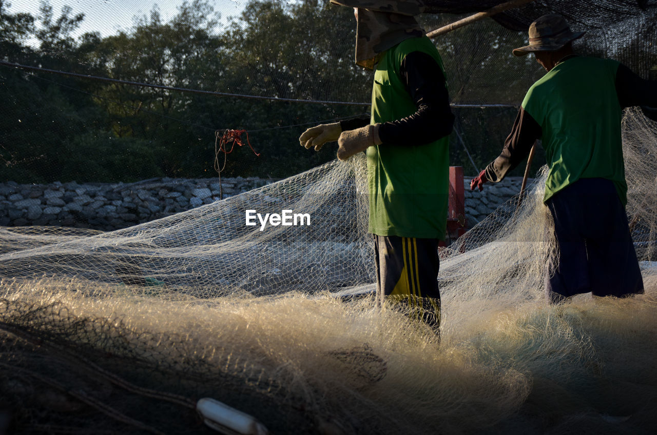 People working on fishing net