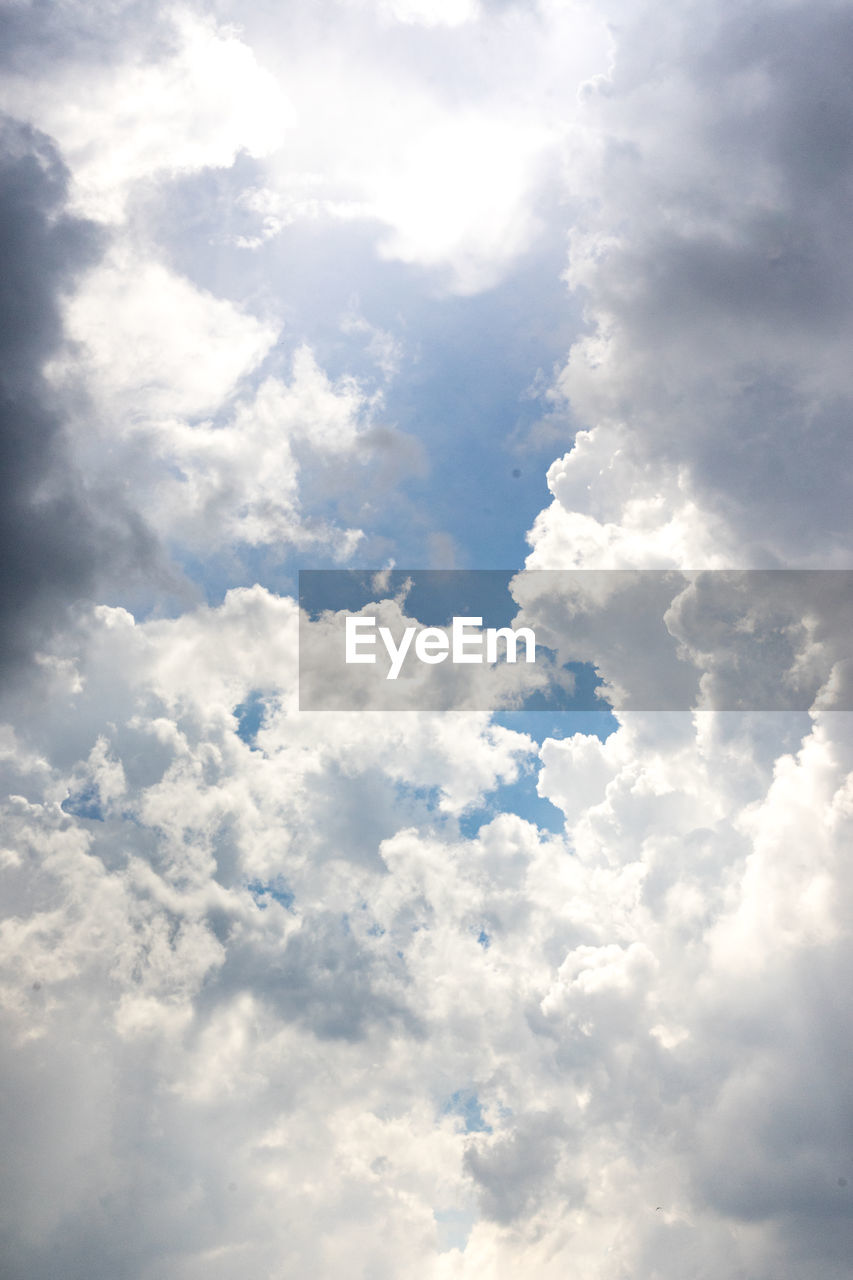 LOW ANGLE VIEW OF CLOUDS IN BLUE SKY