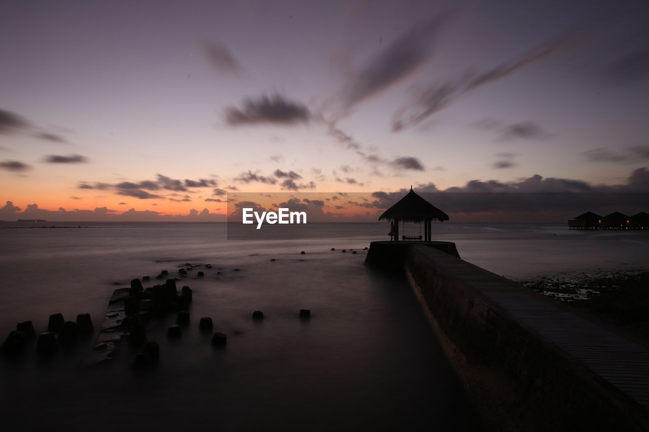 SCENIC VIEW OF SEA AGAINST ROMANTIC SKY