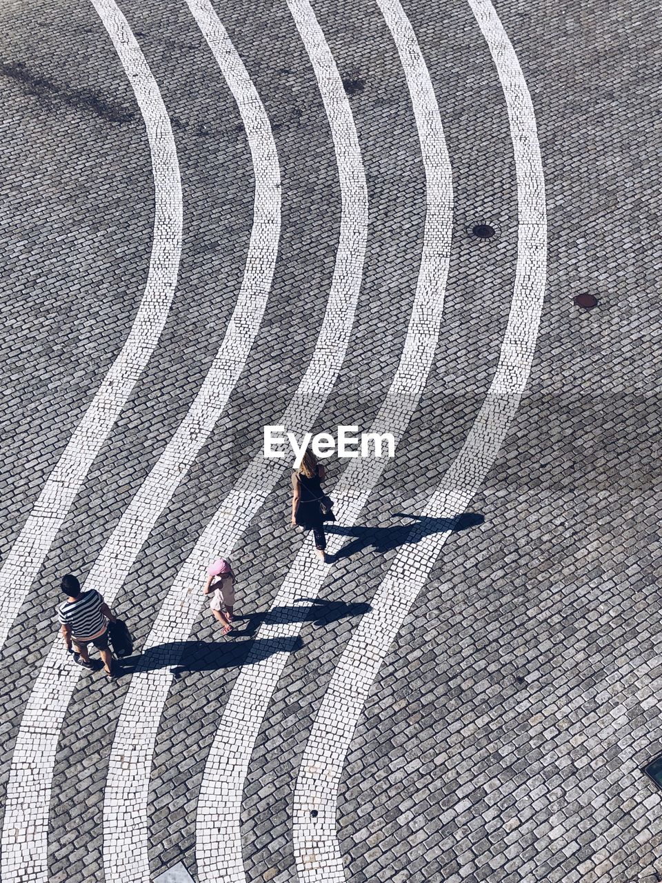 High angle view of family walking on street