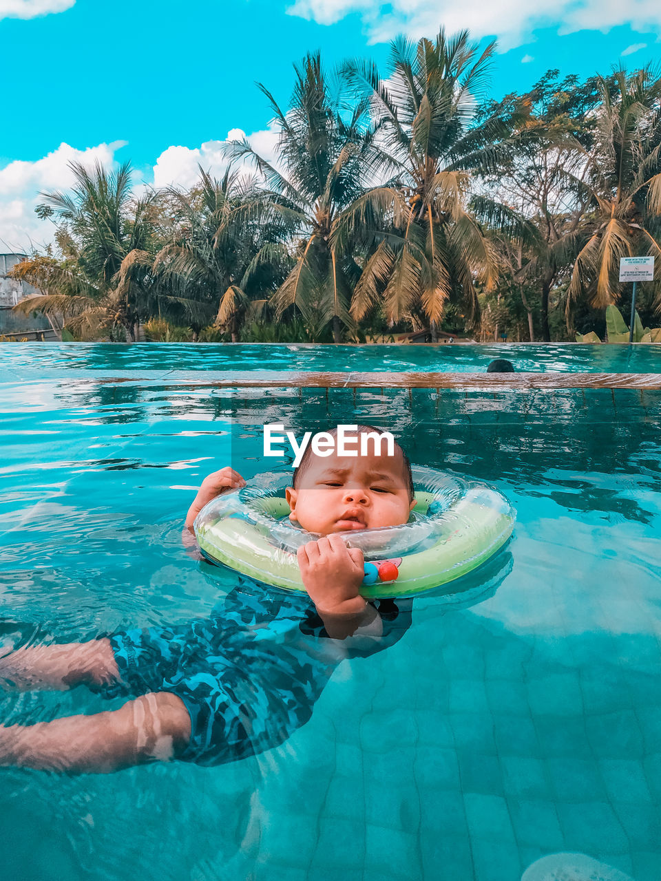 Full length of boy swimming in pool