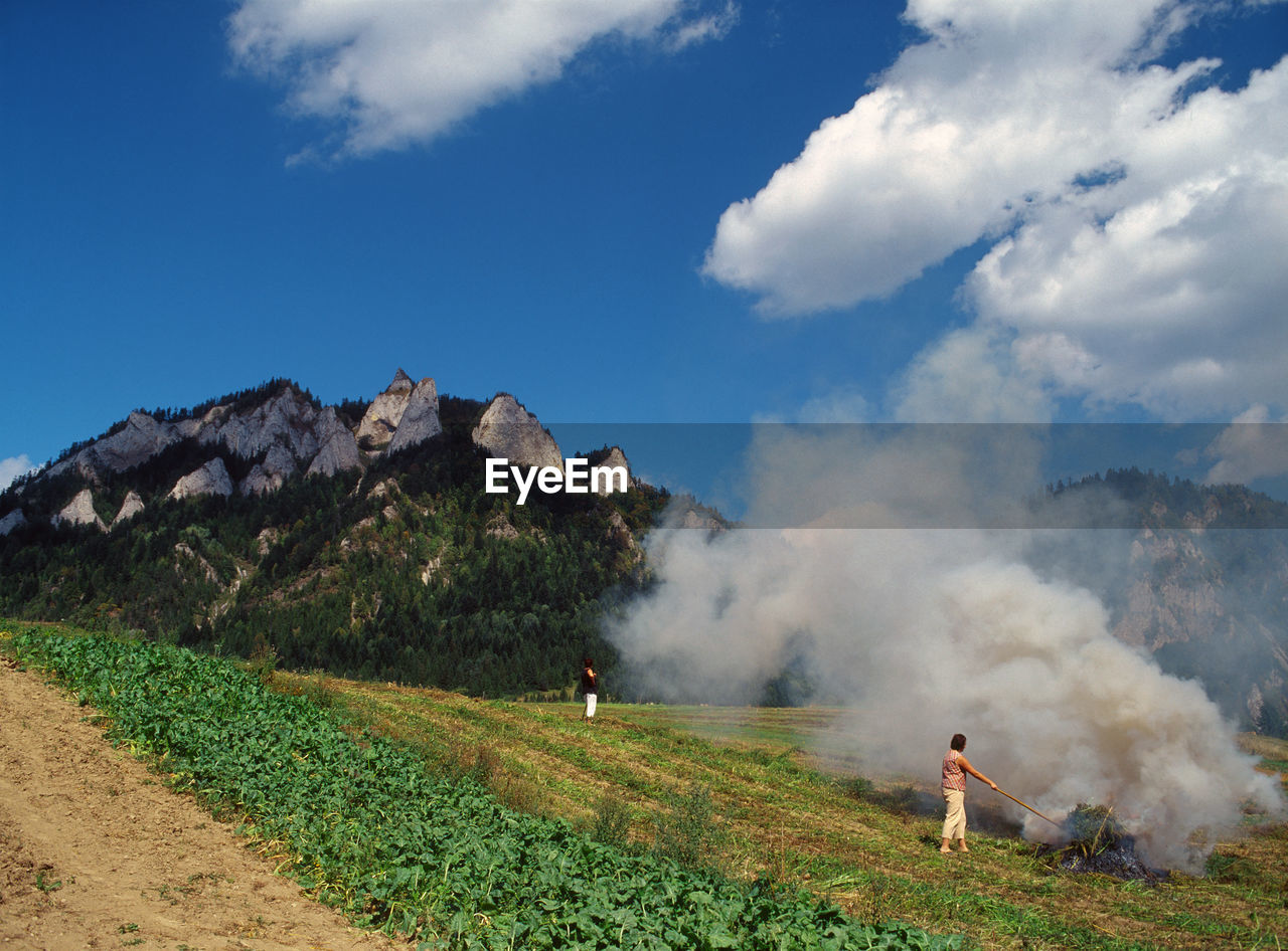 VIEW OF MAN ON MOUNTAIN