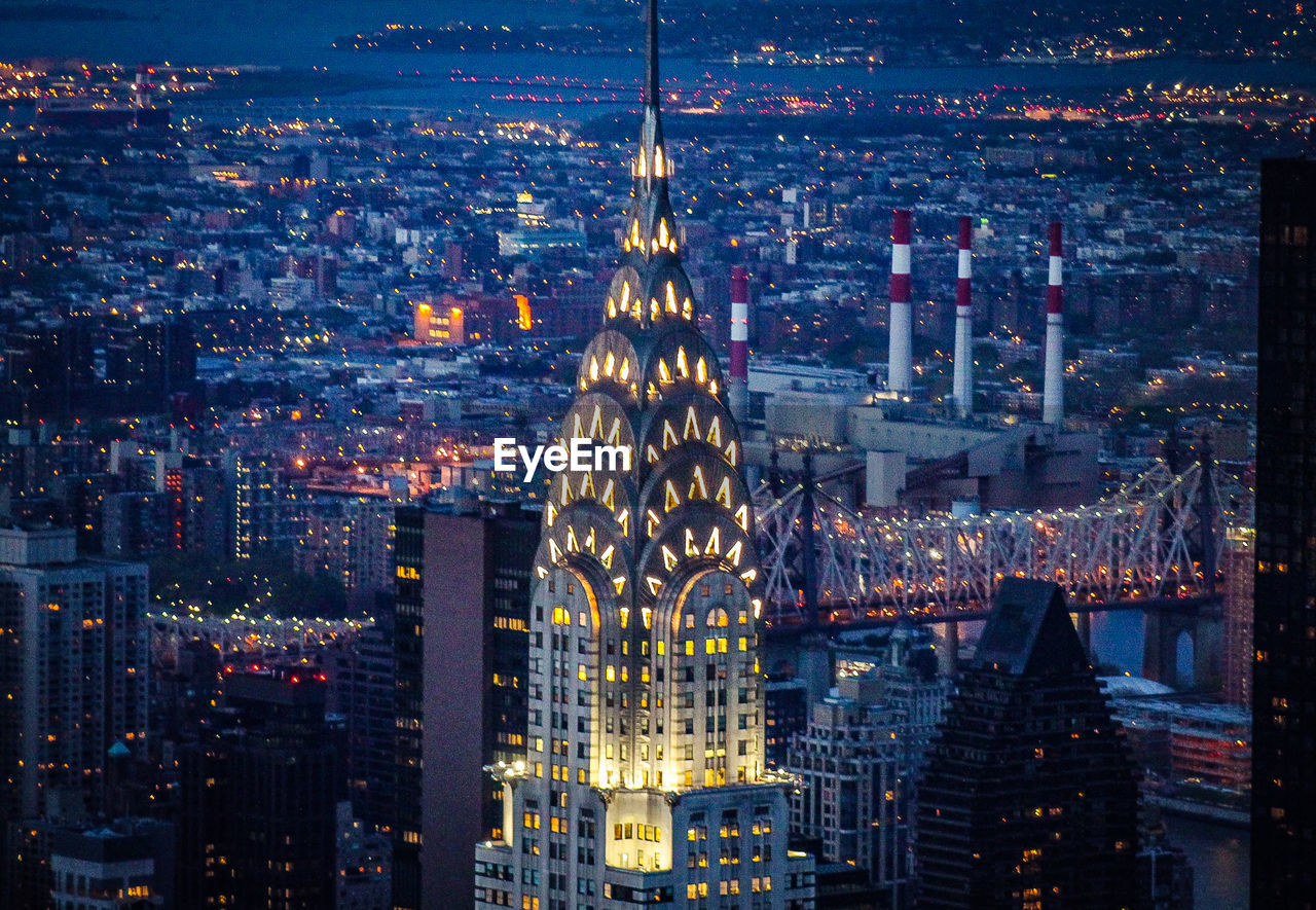 The chrysler building, new york, illuminated during a busy weekday evening. captured from the top of 