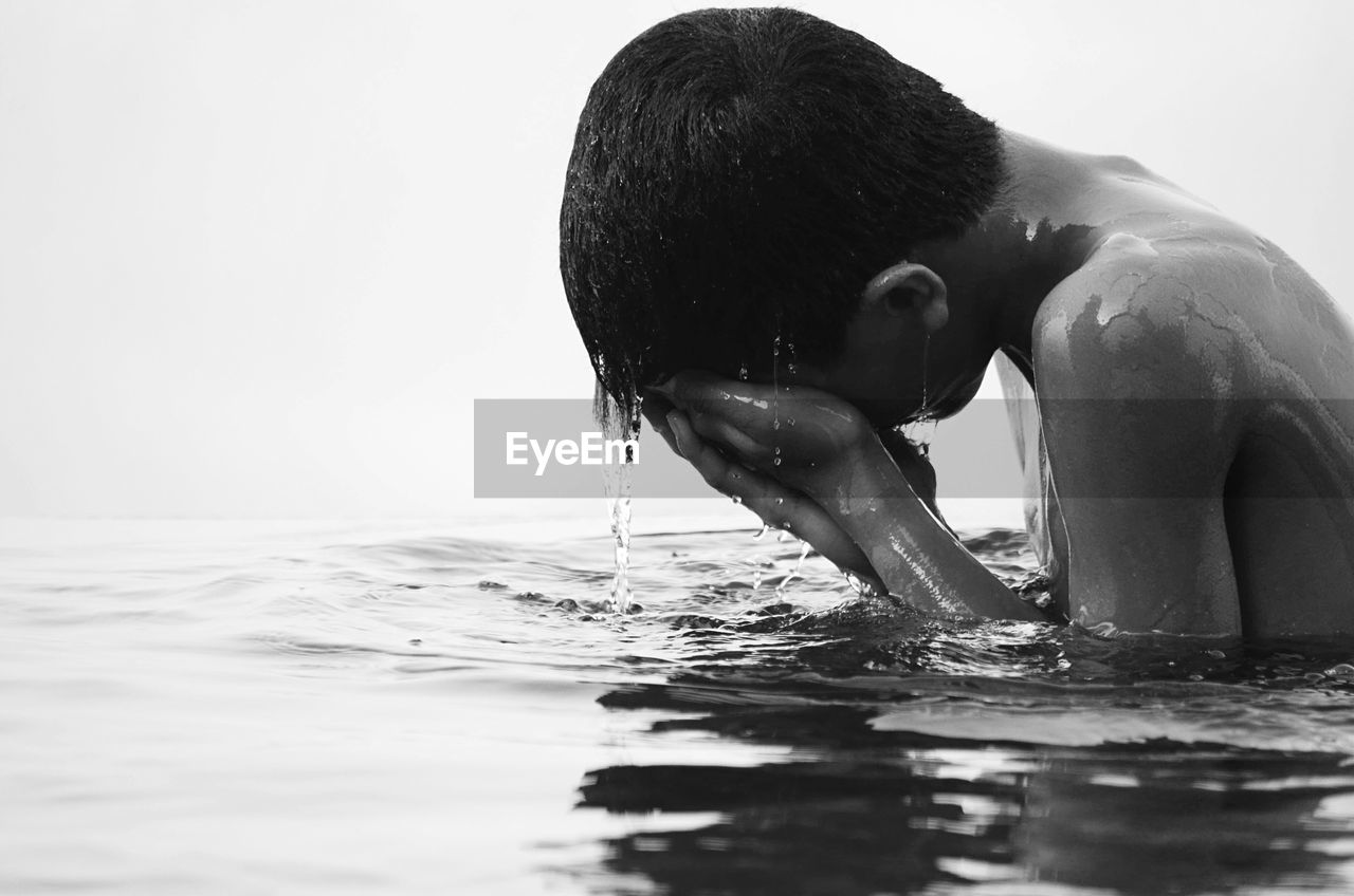 Close-up of boy in water