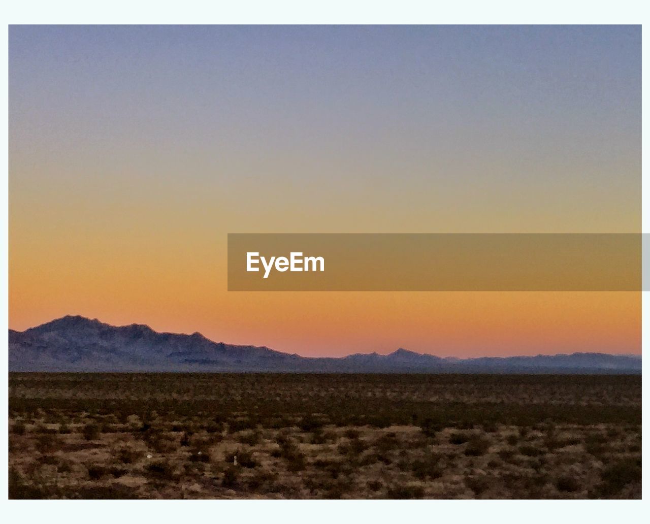 SCENIC VIEW OF SILHOUETTE MOUNTAIN AGAINST CLEAR SKY