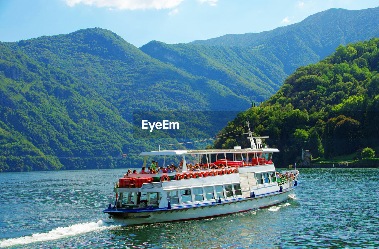 SCENIC VIEW OF RIVER WITH MOUNTAINS IN BACKGROUND