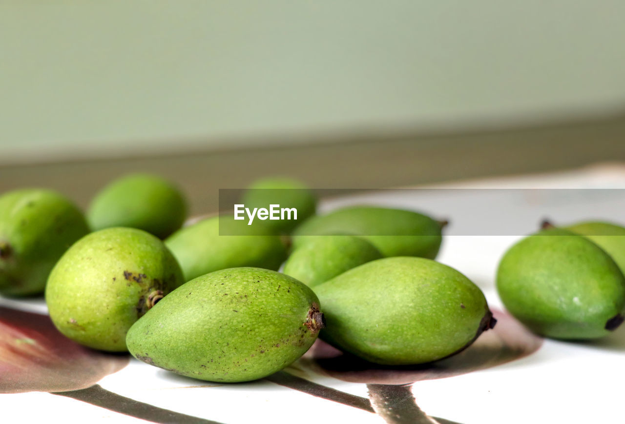 food and drink, food, healthy eating, freshness, wellbeing, fruit, green, produce, lime, plant, indoors, no people, close-up, focus on foreground, citrus, organic, lifestyles, still life, studio shot, group of objects