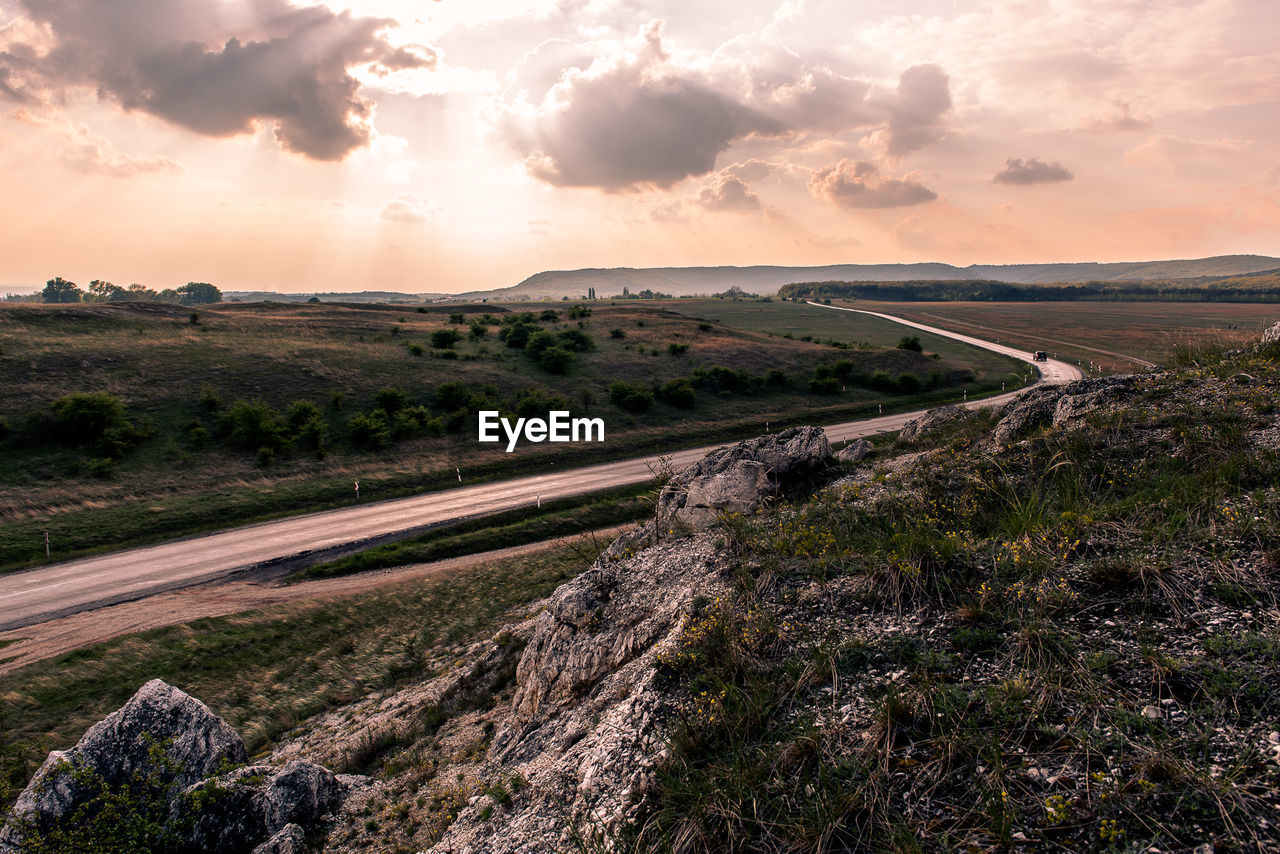 Road against sky during sunset