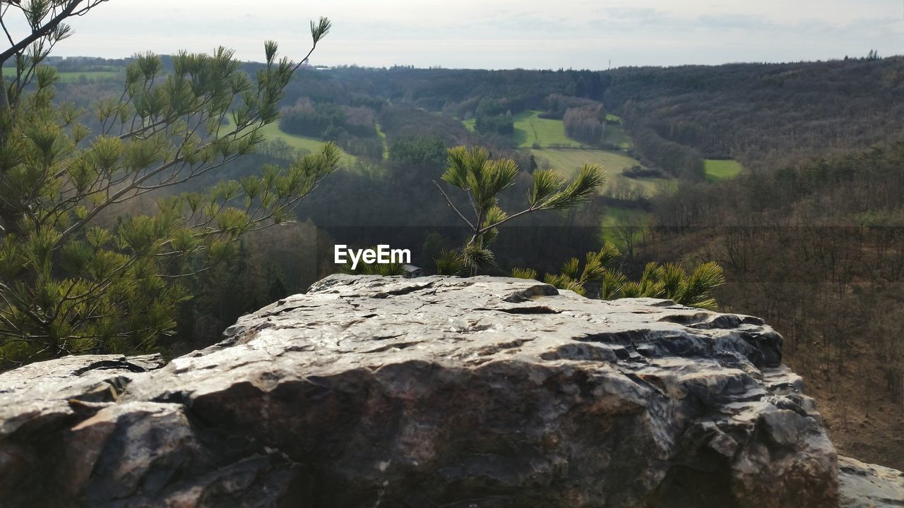 Scenic view of mountains against cloudy sky