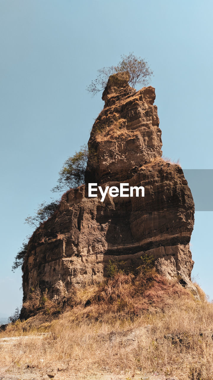 LOW ANGLE VIEW OF ROCK FORMATION