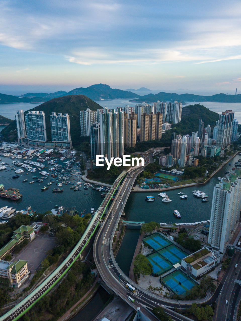 Aerial view of cityscape against sky during sunset