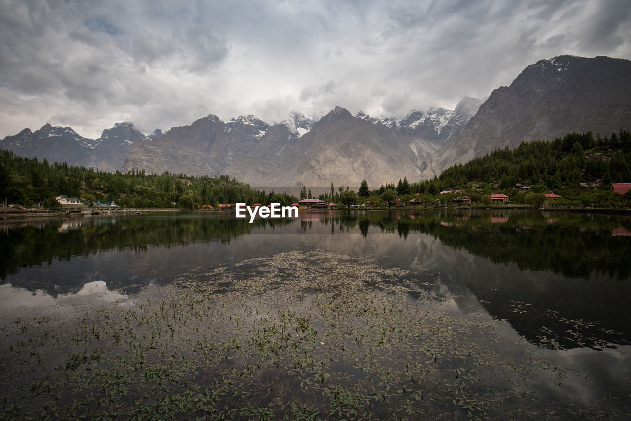 Scenic view of lake and mountains against sky