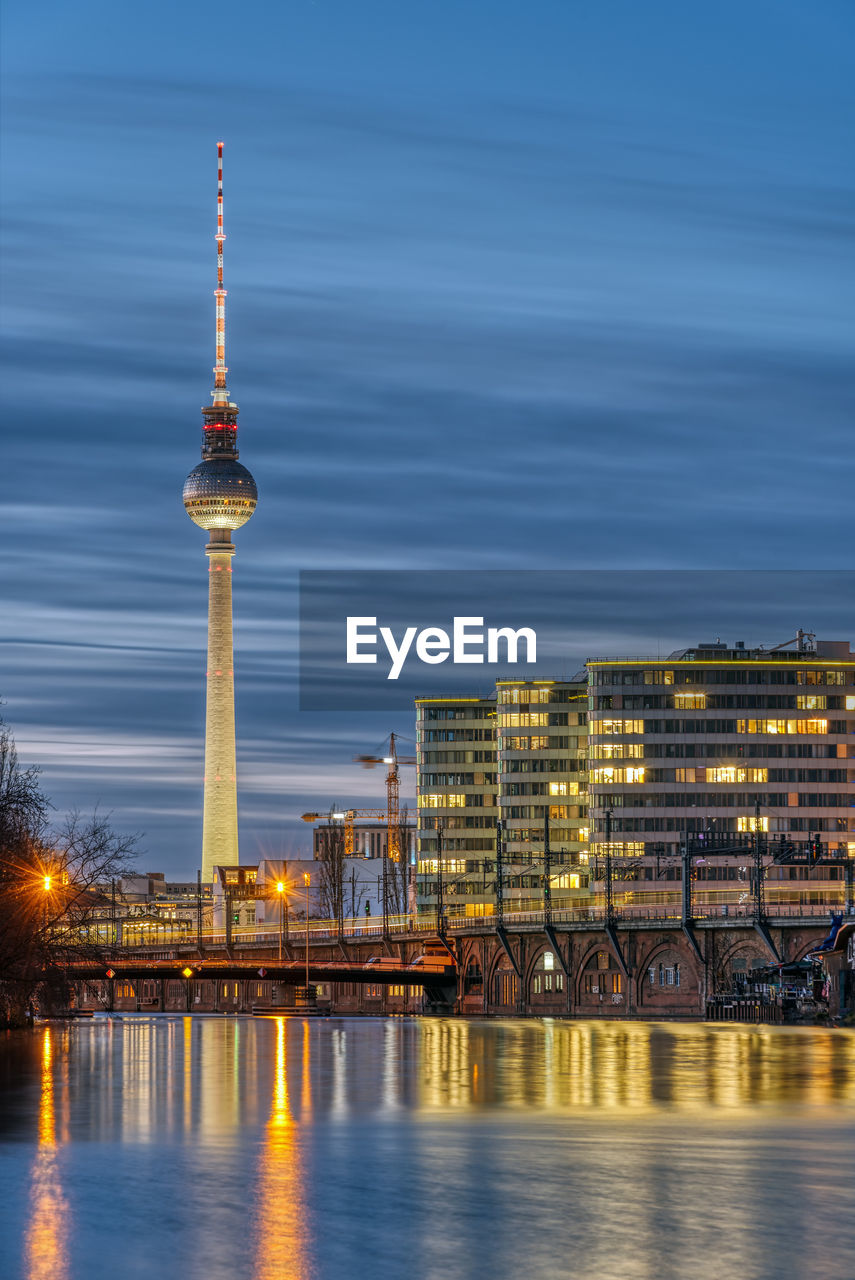 The famous television tower and the river spree in berlin at dusk