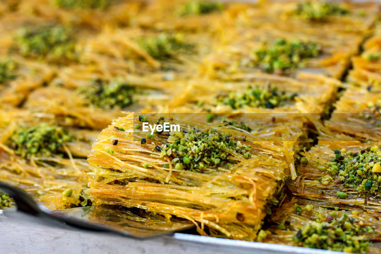 Traditional turkish desserts baklava and lokum in open buffet restaurant at hotel 