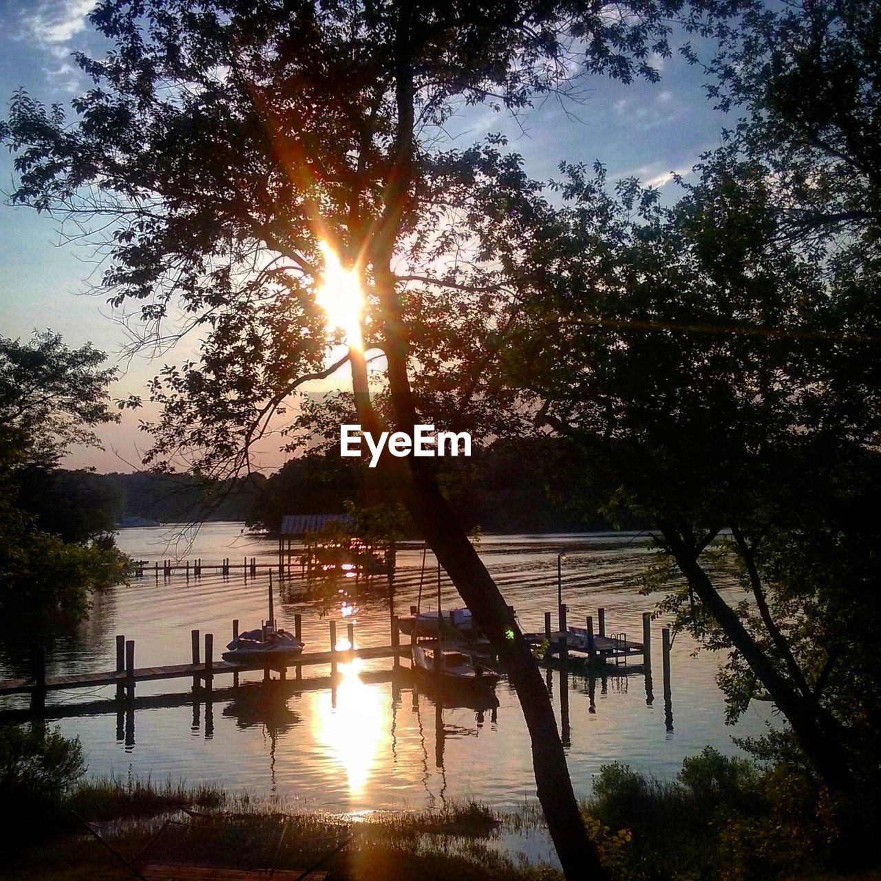 Scenic view of lake at sunset