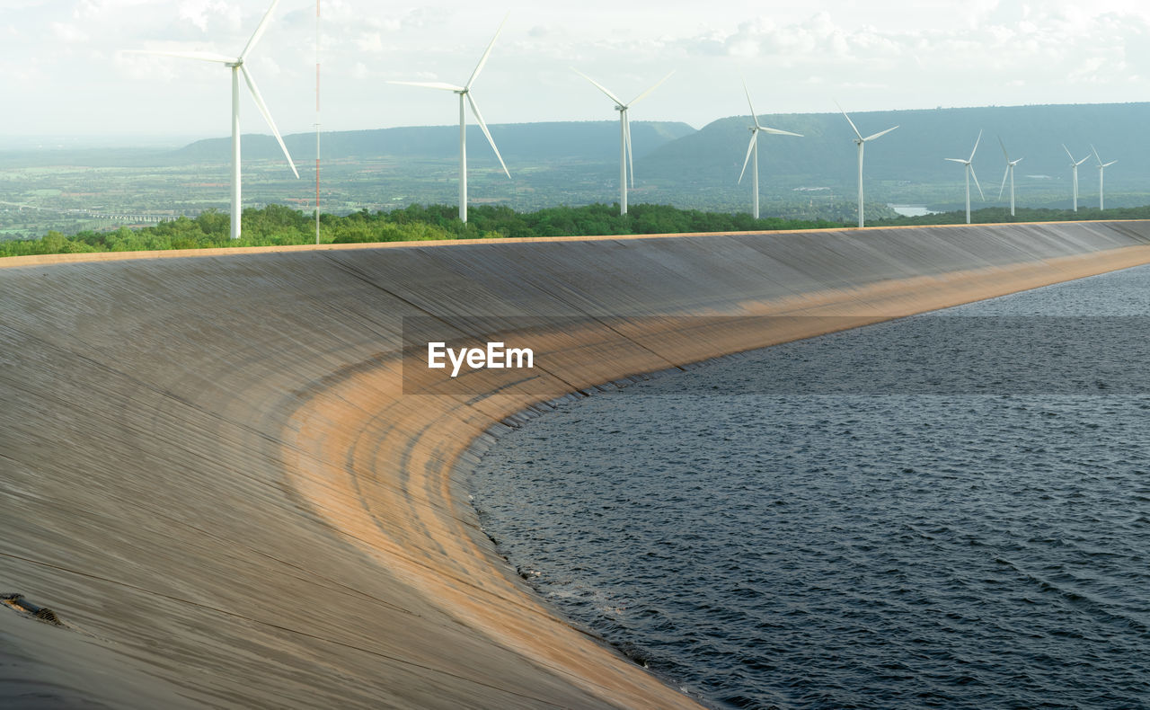 Hdpe plastic lined water reservoirs and landscape of wind farm for power generating stations. 