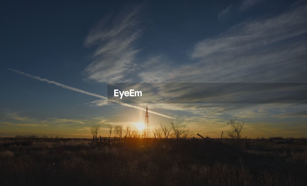 SCENIC VIEW OF SUNSET OVER LANDSCAPE