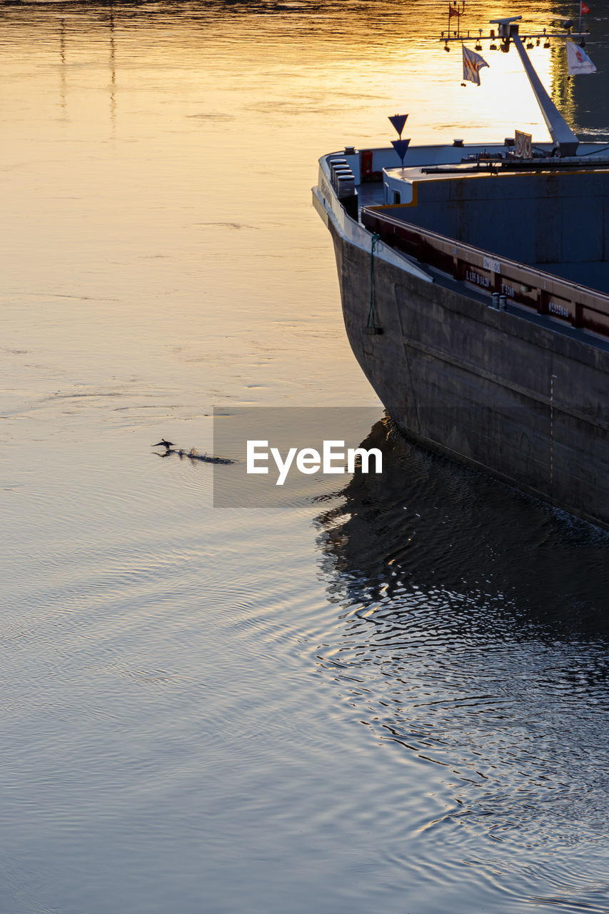 HIGH ANGLE VIEW OF SHIP MOORED ON SEA