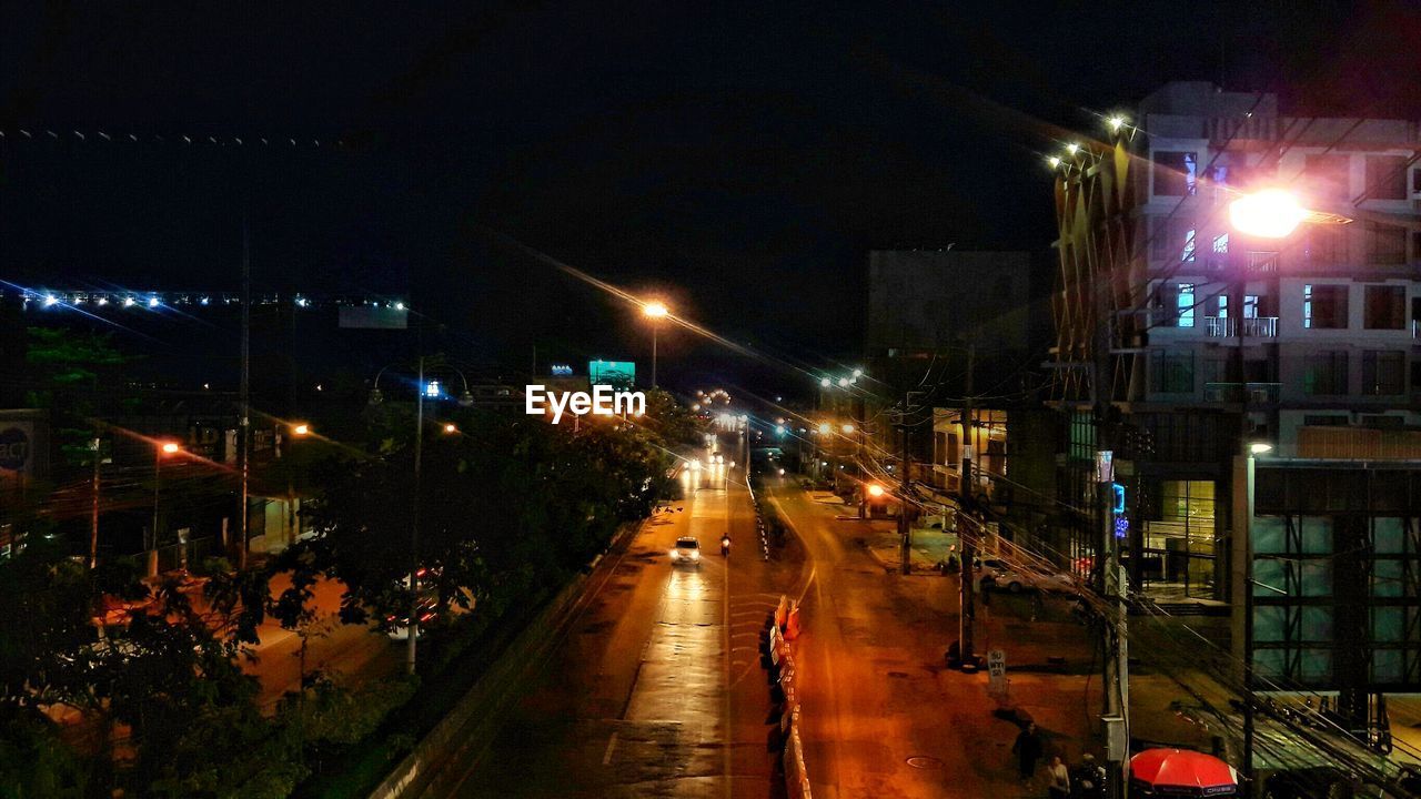 High angle view of illuminated street at night