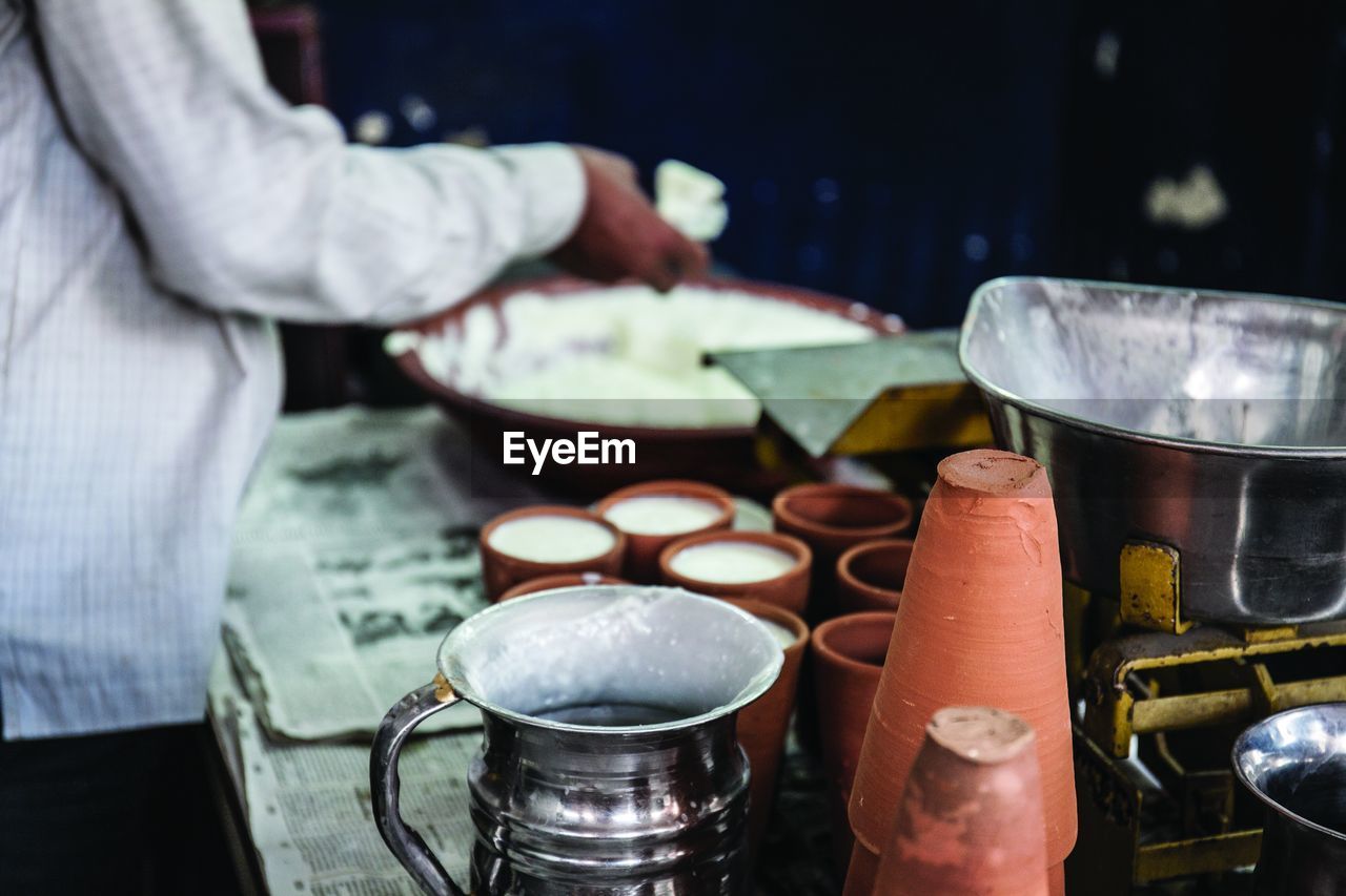 Close-up of man preparing food