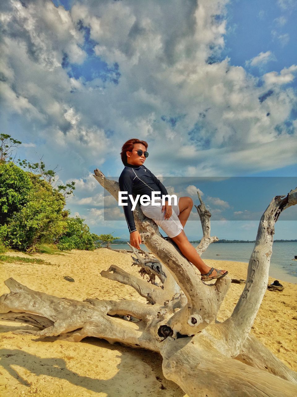 Full length of man on beach against sky