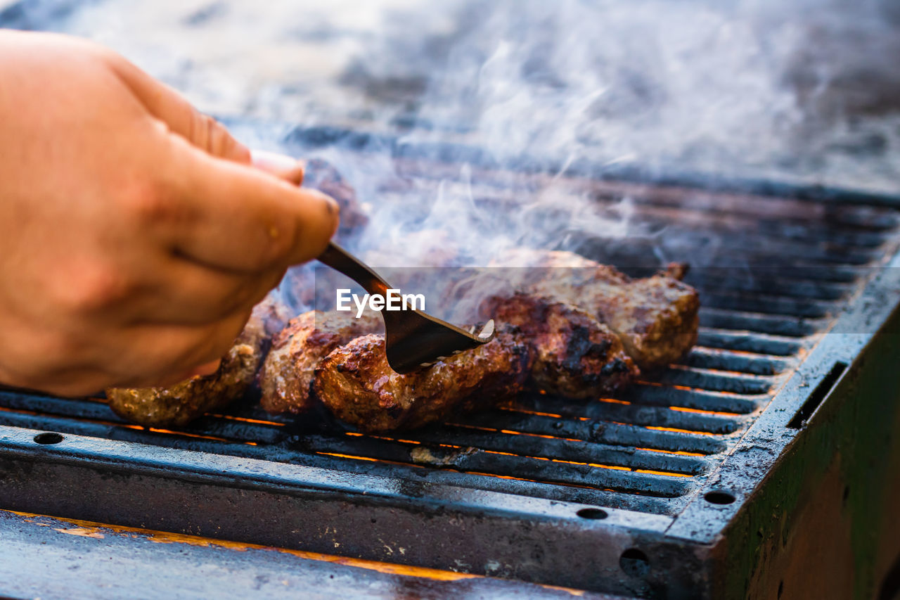 cropped hand of person preparing food