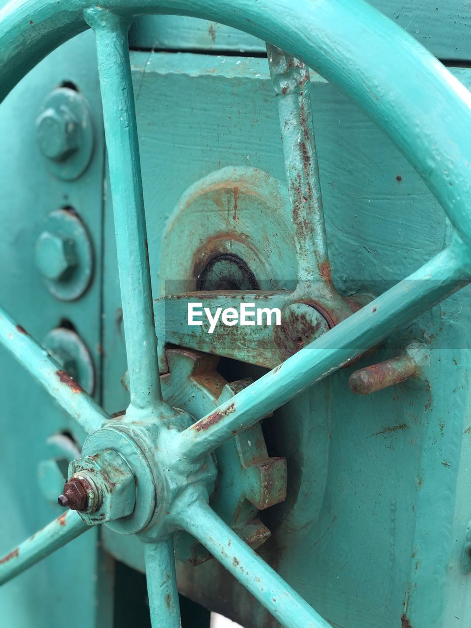 Close-up of metallic wheel on machinery