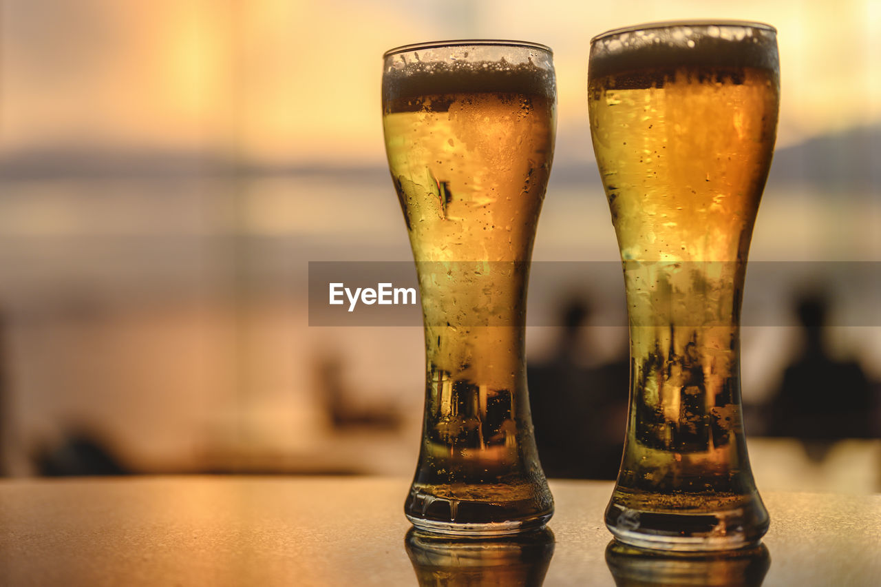 CLOSE-UP OF BEER ON TABLE