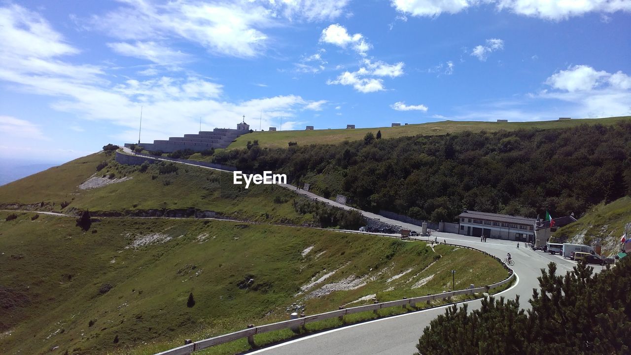 High angle view of road by mountain against sky